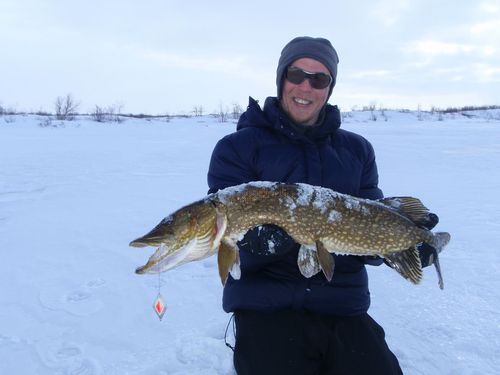Images Of Ice Fishing. Pike`s ice fishing in Lapland